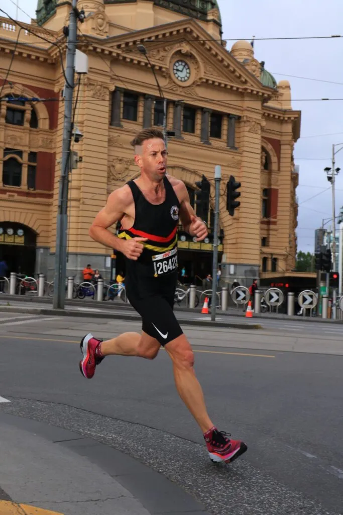 Runner approaching MCG finish line at Nike Melbourne Half Marathon 2023