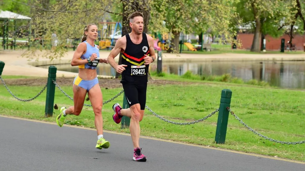 Runner competing at Nike Melbourne Half Marathon 2023 race through Albert Park